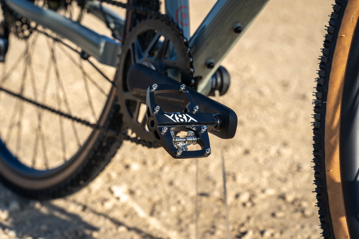 Origin8 Dual Sport Midi pedal mounted on a bike, platform side with grip pins visible